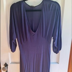 Navy blue dress with gold detail on the back.